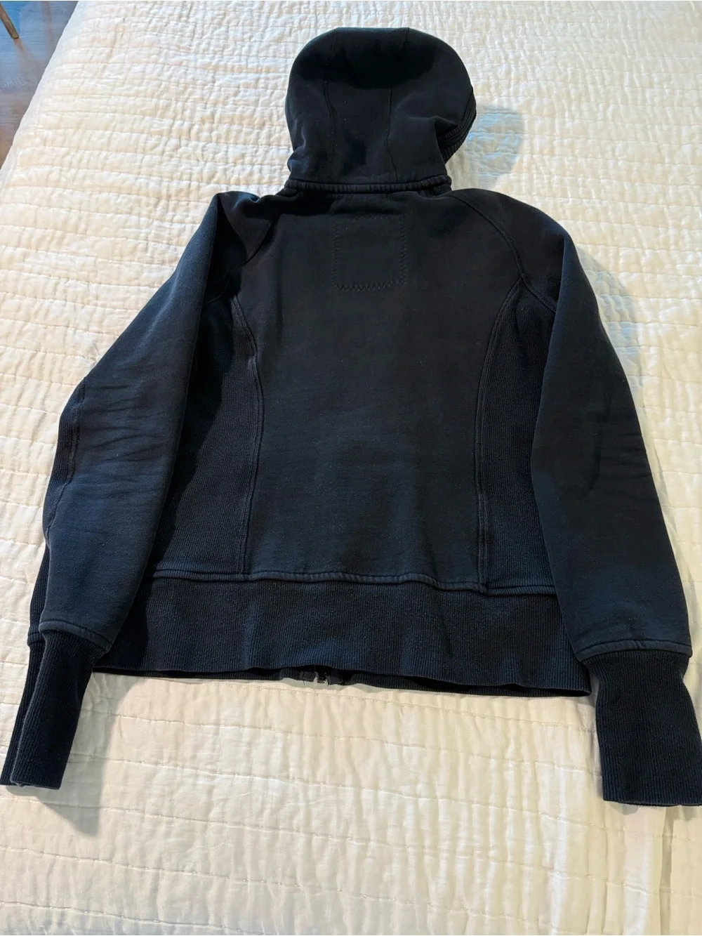lululemon athletica. Special edition.  black jacket with ruffle trim and hood.